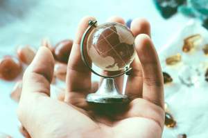 hand holding a globe